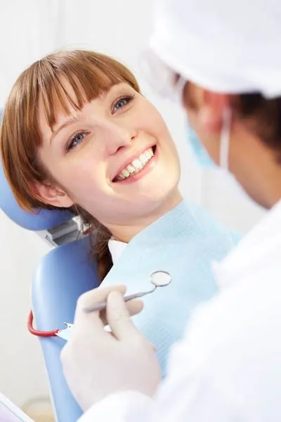 woman smiling during her cosmetic dentistry procedure at Corson Dentistry