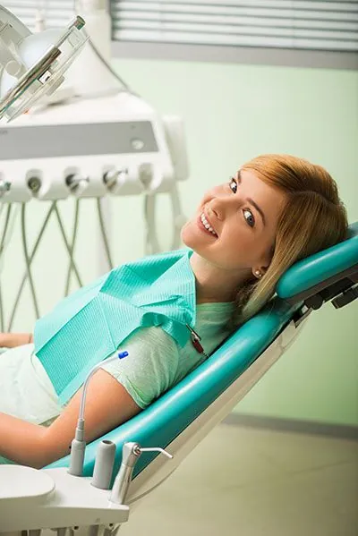 patient smiling in the dental chair
