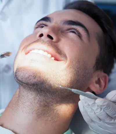 man very relaxed during his dental appointment thanks to sedation dentistry